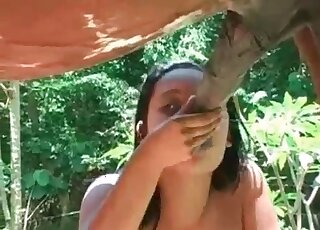 Brunette bitch stuffs filthy mouth with enormous dong of a stallion